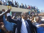 Aristide au bureau de vote